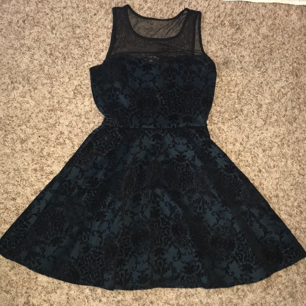 Elegant dark green dress with black velvet detail